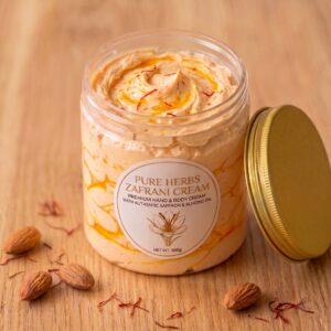 Pure Herbs Zafrani Cream 500g jar with gold lid surrounded by almond nuts and authentic saffron threads